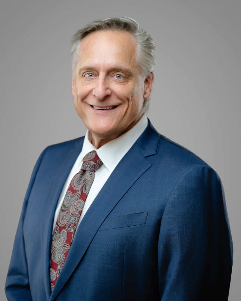 headshot of Brett J. Trout