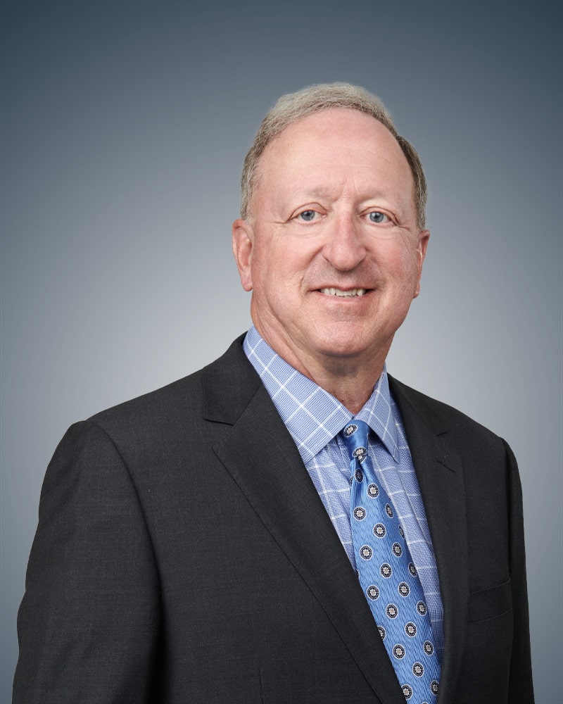 profile headshot of Mark E. Roth