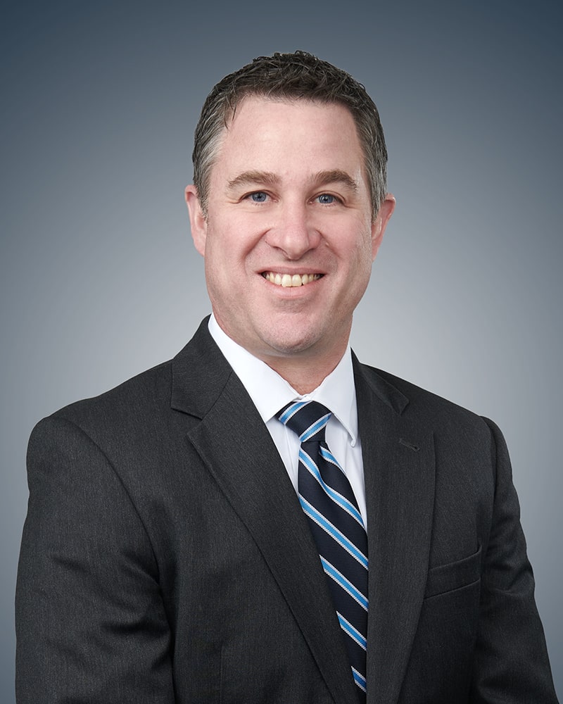 headshot of Justin G. Allen